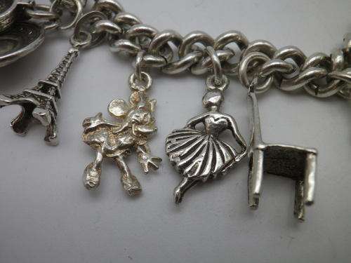 Sterling Silver Vintage Charm bracelet. Hallmarked clasp. Heavy Rare charm. 72grms Excellent quality
