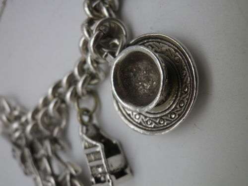 Sterling Silver Vintage Charm bracelet. Hallmarked clasp. Heavy Rare charm. 72grms Excellent quality