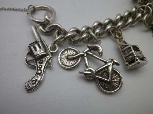 Sterling Silver Vintage Charm bracelet. Hallmarked clasp. Heavy Rare charm. 72grms Excellent quality