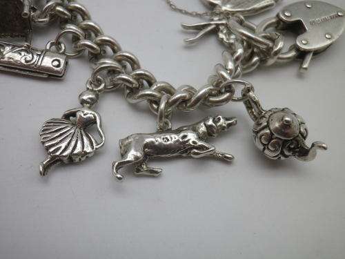 Sterling Silver Vintage Charm bracelet. Hallmarked clasp. Heavy Rare charm. 72grms Excellent quality