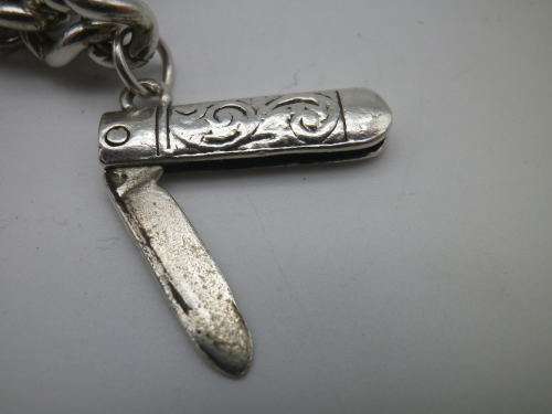 Sterling Silver Vintage Charm bracelet. Hallmarked clasp. Heavy Rare charm. 72grms Excellent quality