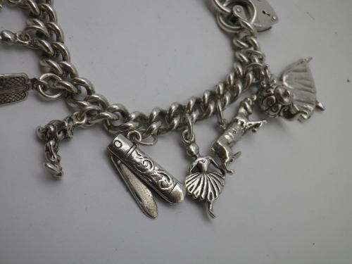 Sterling Silver Vintage Charm bracelet. Hallmarked clasp. Heavy Rare charm. 72grms Excellent quality
