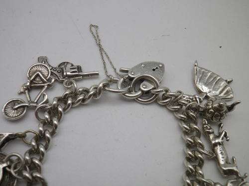 Sterling Silver Vintage Charm bracelet. Hallmarked clasp. Heavy Rare charm. 72grms Excellent quality