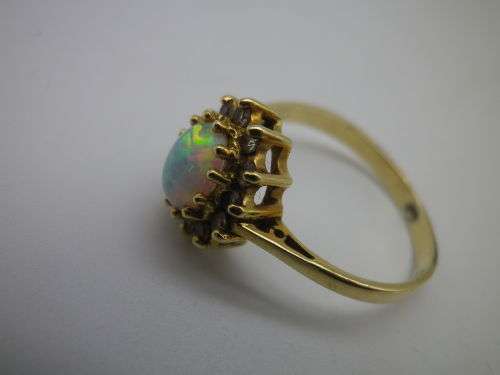 FOR TraHar5654 ONLY PLEASE!! Hallmarked 18ct Yellow Gold, Fire Opal and Diamond Ring. Size J.
