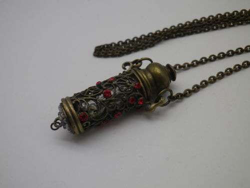 PERFUME BOTTLE PENDANT. Bronze tone metal with red glass beads. Intact. FAB!!!
