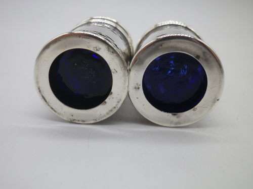 Birmingham 1926 Hallmarked Silver salt and pepper set. Original blue glass liners  Maker: K & L