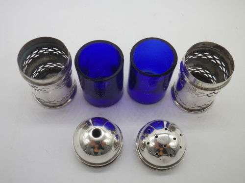 Birmingham 1926 Hallmarked Silver salt and pepper set. Original blue glass liners  Maker: K & L
