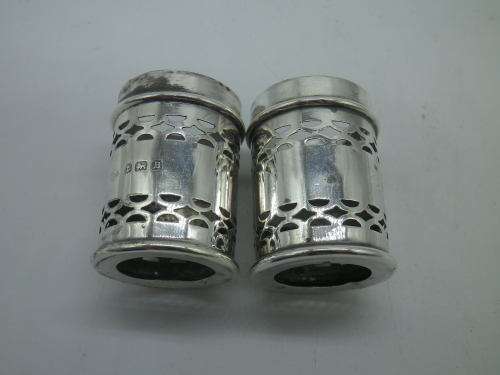 Birmingham 1926 Hallmarked Silver salt and pepper set. Original blue glass liners  Maker: K & L