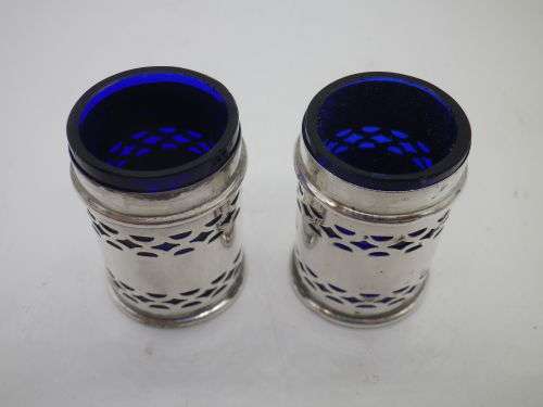 Birmingham 1926 Hallmarked Silver salt and pepper set. Original blue glass liners  Maker: K & L