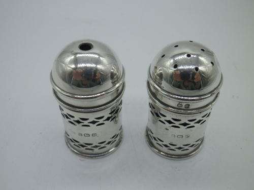 Birmingham 1926 Hallmarked Silver salt and pepper set. Original blue glass liners  Maker: K & L