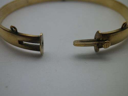 FOR PRANAI ONLY PLEASE!! Vintage 9ct Gold clip bangle with bronze core.