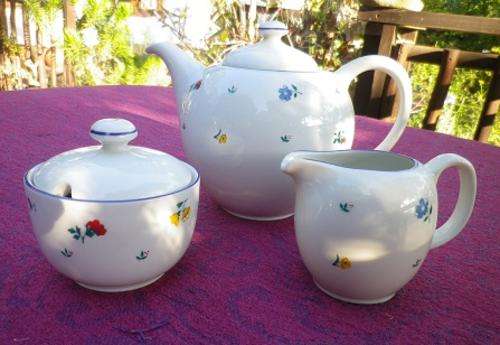 Charming white with dainty flowers teaset. Pot, creamer, sugar bowl. "Continental" fine china