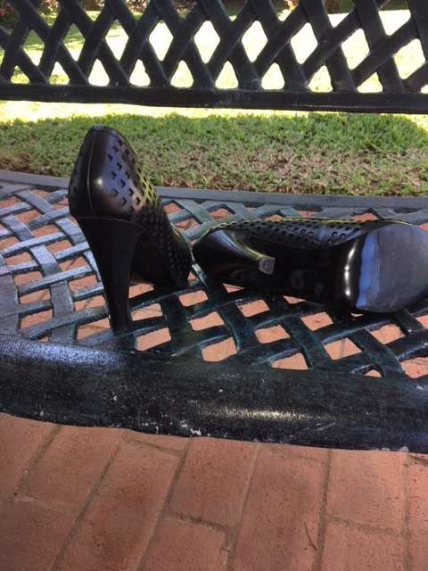 High black heels featuring small square cut outs