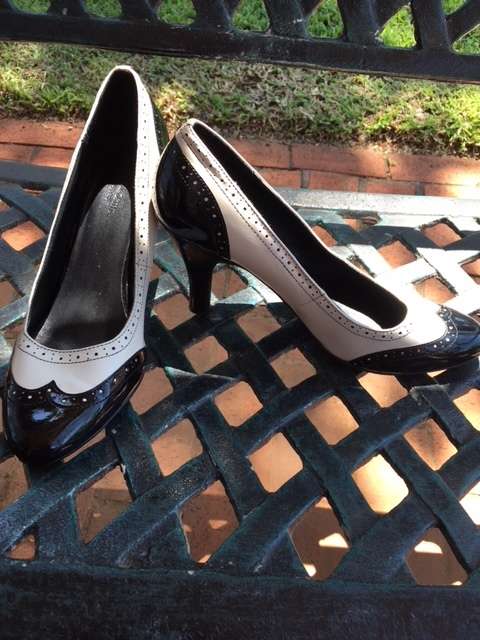 Black and white brogue heels
