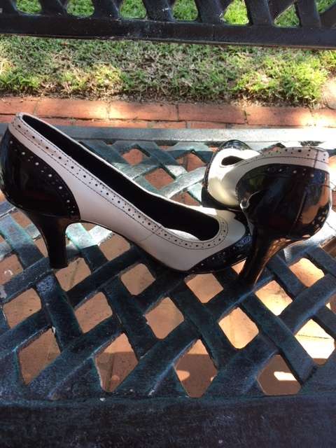 Black and white brogue heels