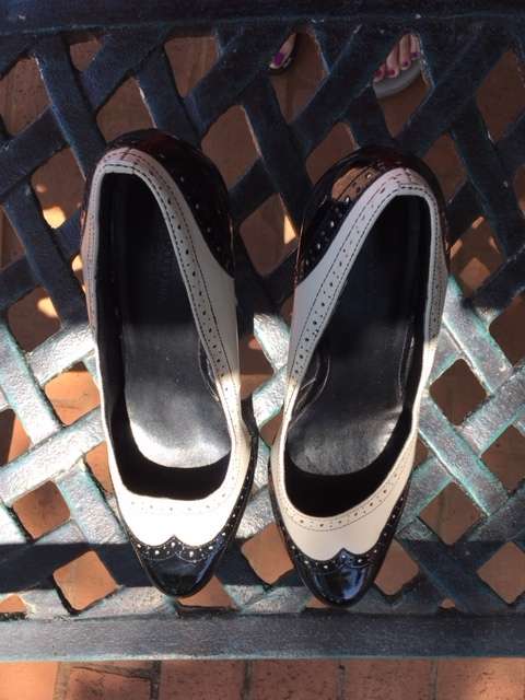 Black and white brogue heels