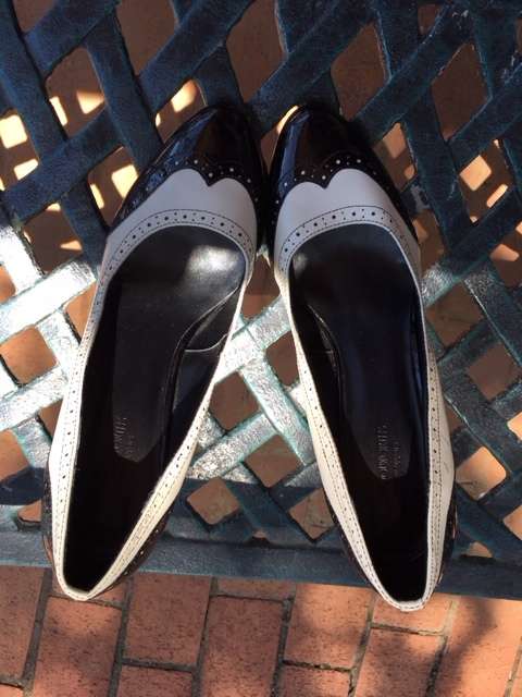 Black and white brogue heels
