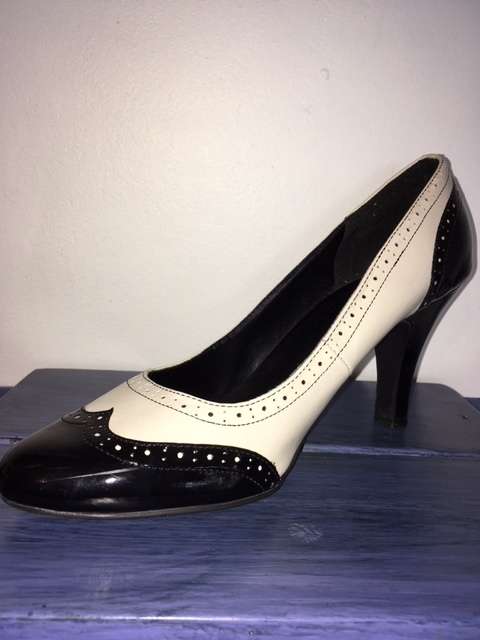 Black and white brogue heels