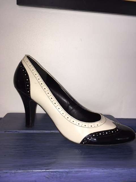 Black and white brogue heels