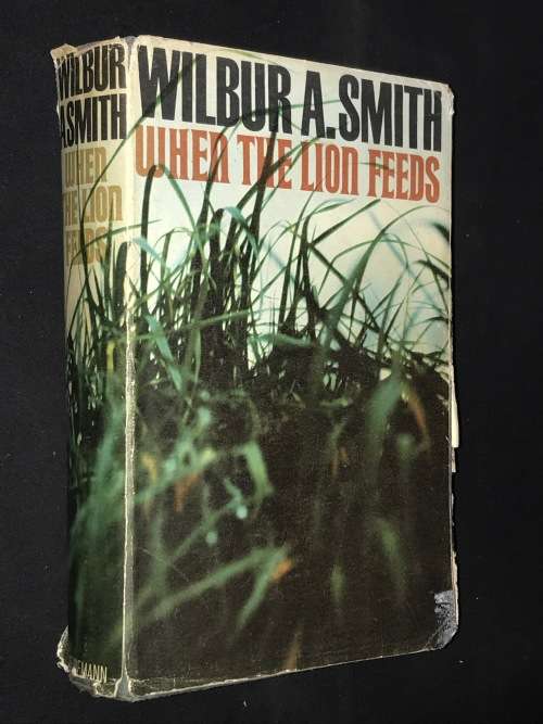 WHEN THE LION FEEDS BY WILBUR SMITH
