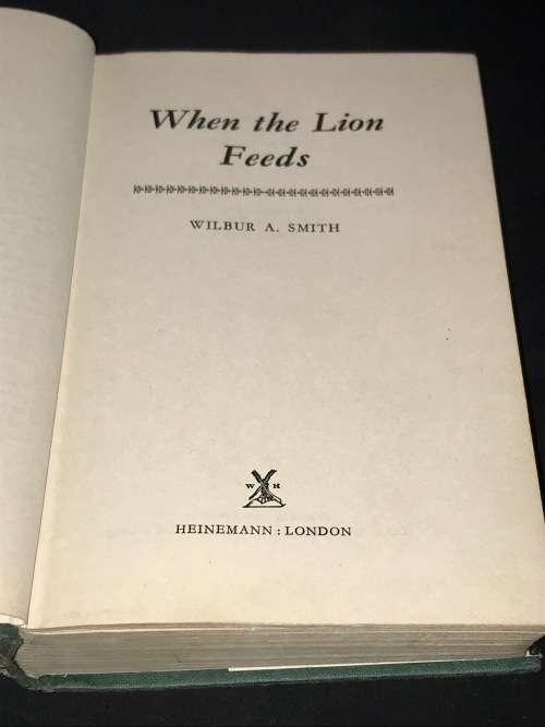 WHEN THE LION FEEDS BY WILBUR SMITH