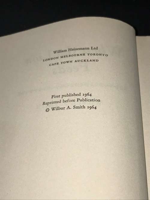 WHEN THE LION FEEDS BY WILBUR SMITH