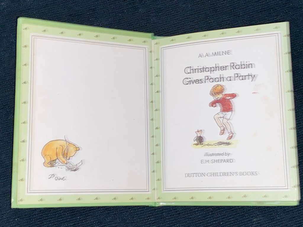 CHRISTOPHER ROBIN GIVES POOH A PARTY BY A.A. MILNE