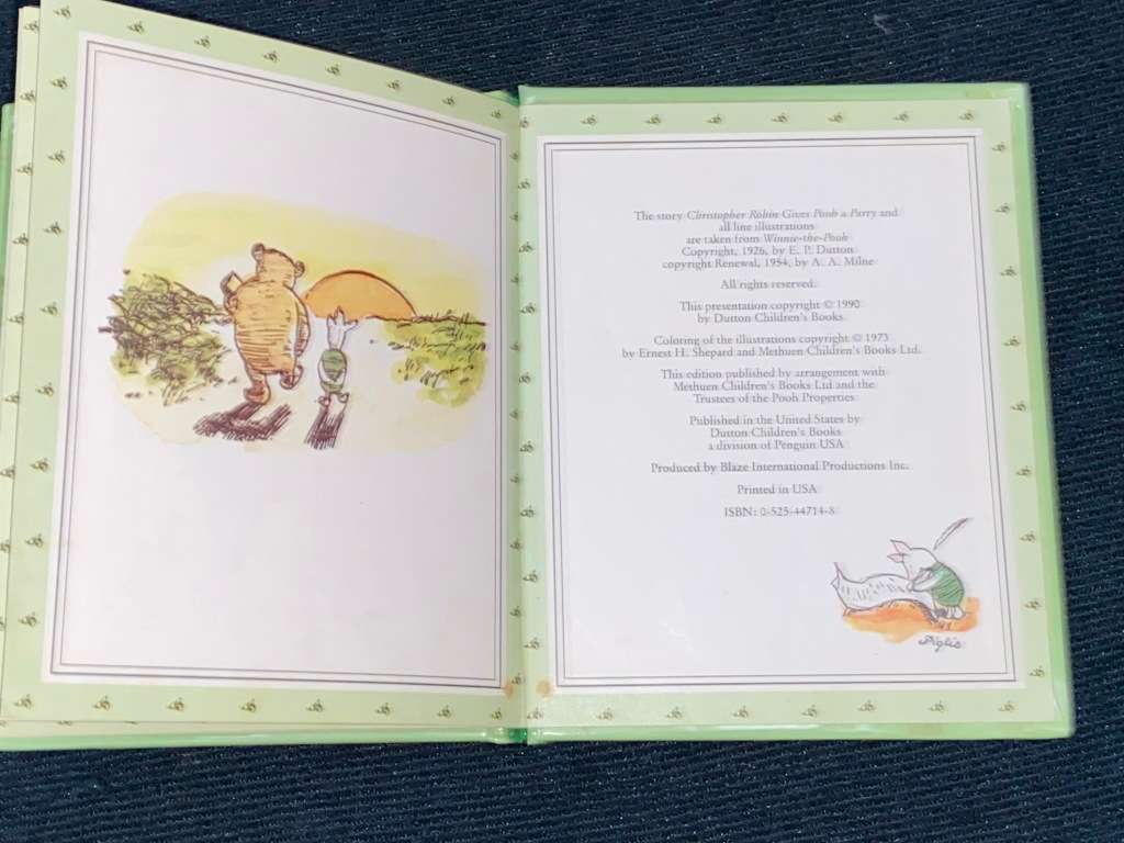 CHRISTOPHER ROBIN GIVES POOH A PARTY BY A.A. MILNE