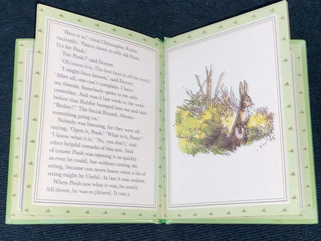 CHRISTOPHER ROBIN GIVES POOH A PARTY BY A.A. MILNE