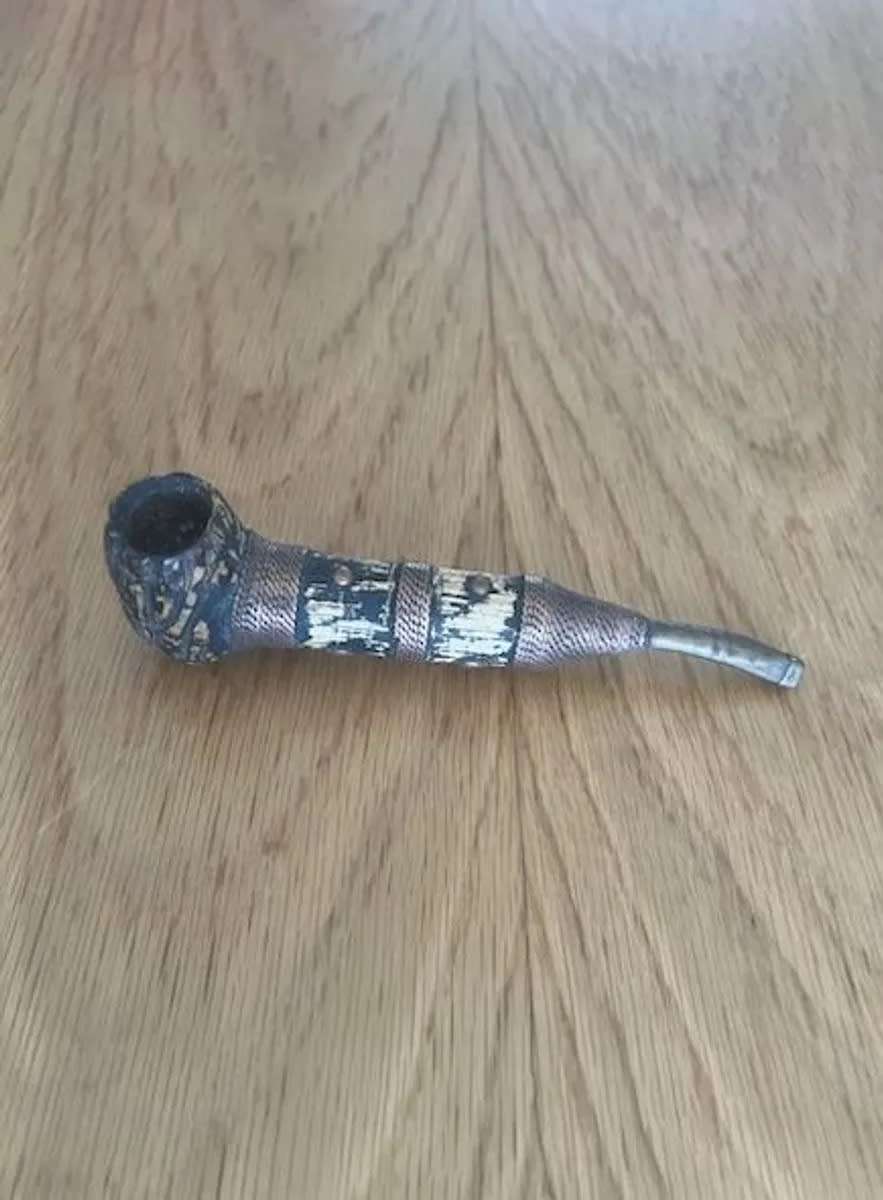 Old bronze-coloured pipe