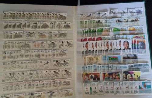 A4 Stock Album stacked with mostly used Union and RSA stamps