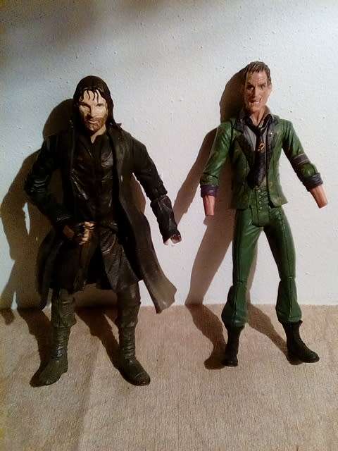 Two Action Figurines with Defects