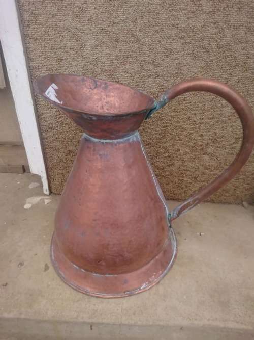 large copper water jug