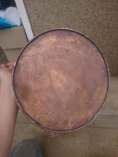 large copper water jug