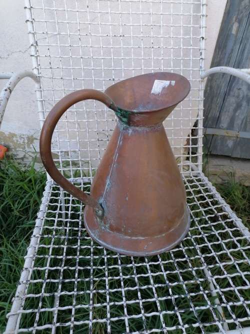 large copper water jug