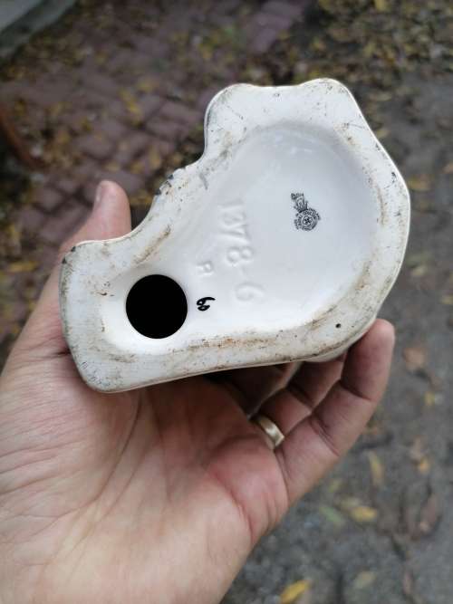 Royal Doulton dog porcelain figure. Have been repaired