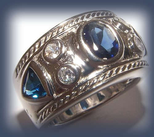 SAPPHIRE AND WHITE CZ STERLING SILVER RING.
