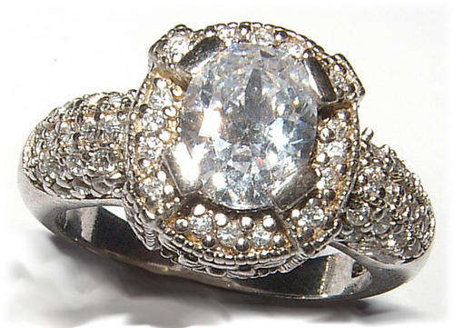 WHITE CZ STERLING SILVER RING.