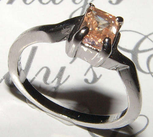 SWEET WHITE GOLD PLATED IMPERIAL ORANGE CZ RING