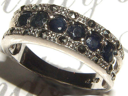 BLACK DIAMONDS AND  NATURAL MARCASITE STERLING SILVER RING.