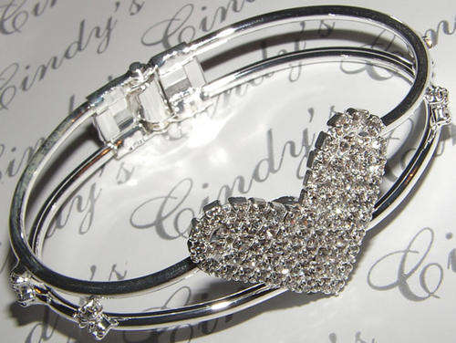 GLAMOUR AND GLITZ  WHITE RHINESTONE LADIES BANGLE!