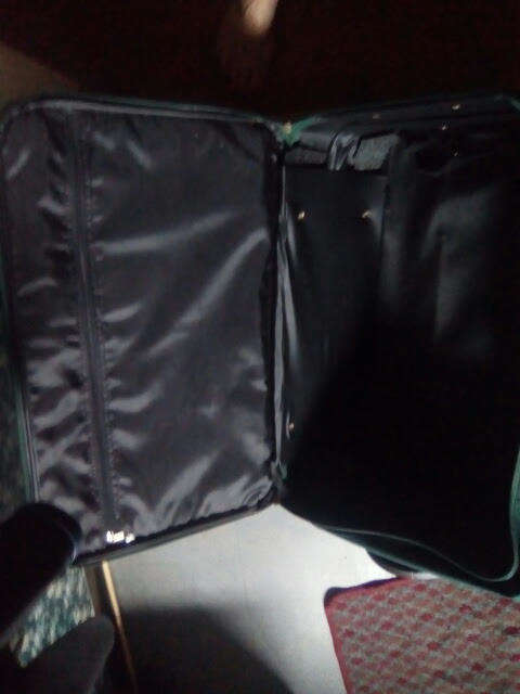 Green Duigui suit case on wheels