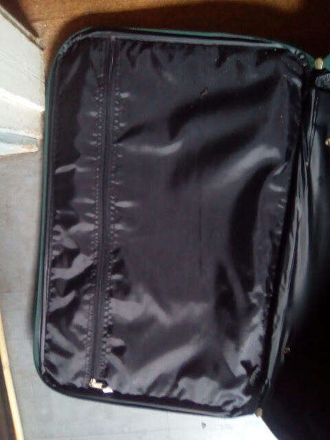 Green Duigui suit case on wheels