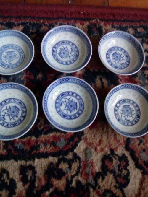 11 of 6 cm porcelain  bowls and 11 rice spoons