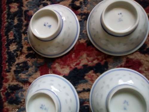 11 of 6 cm porcelain  bowls and 11 rice spoons