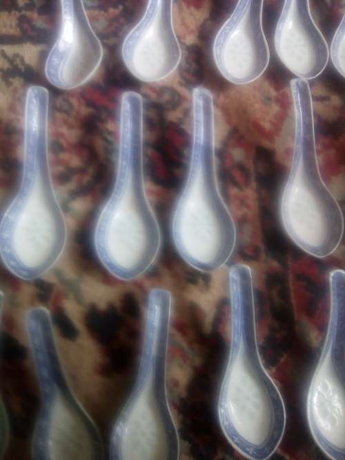 11 of 6 cm porcelain  bowls and 11 rice spoons