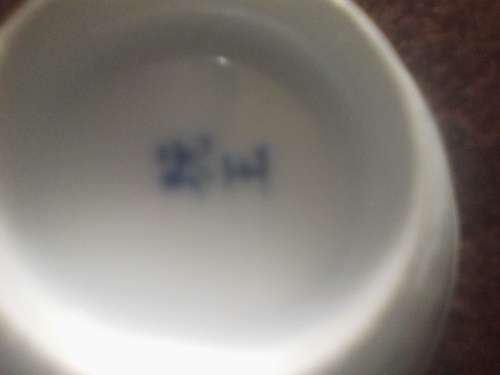 11 of 6 cm porcelain  bowls and 11 rice spoons