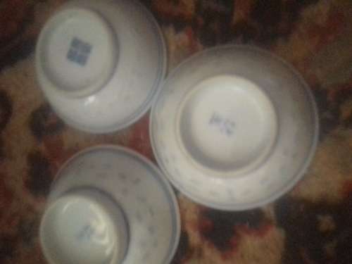 11 of 6 cm porcelain  bowls and 11 rice spoons