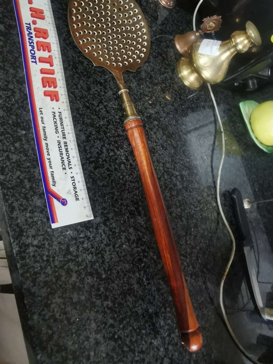 Vintage long brass kitchen utensil