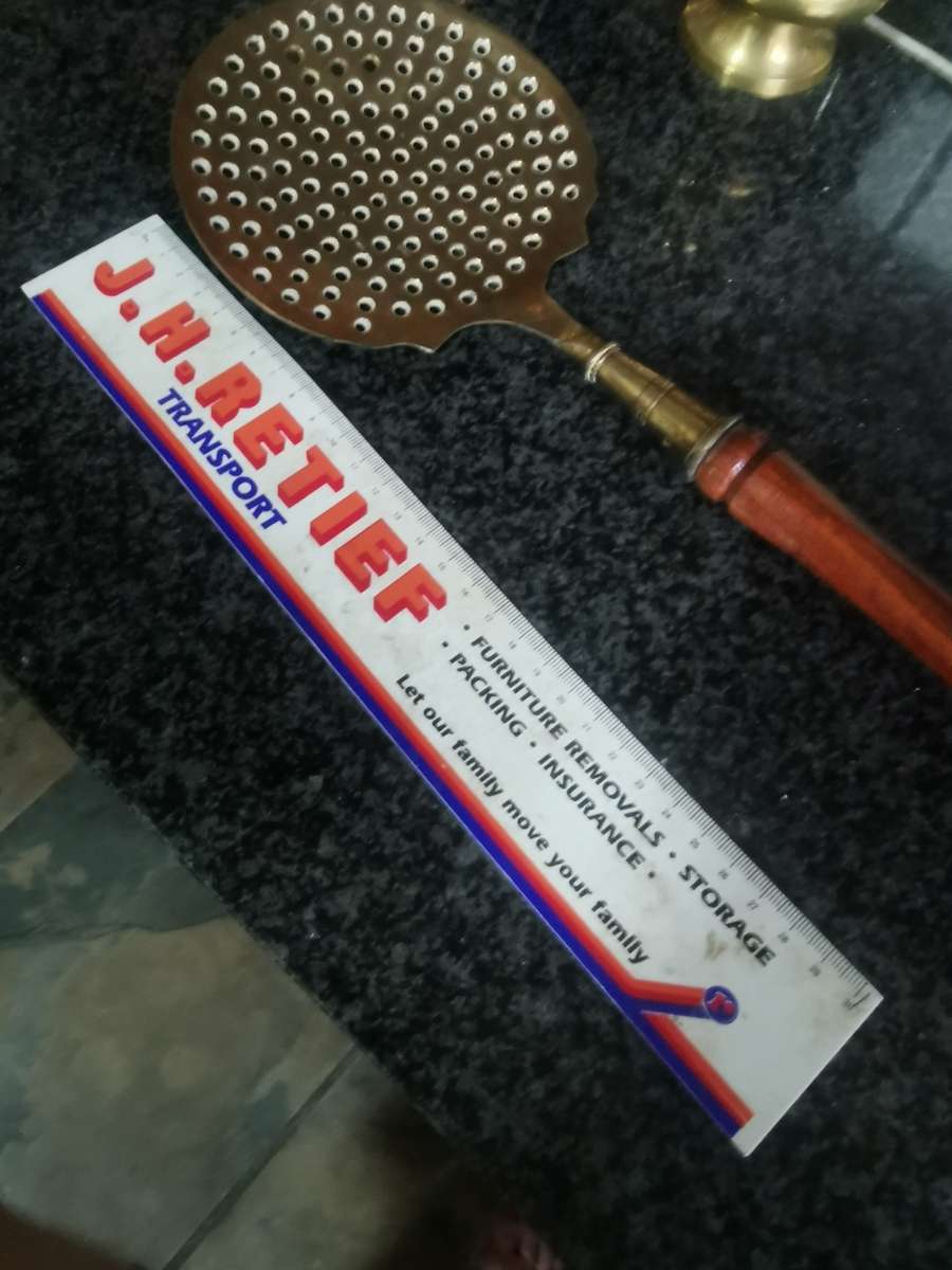 Vintage long brass kitchen utensil